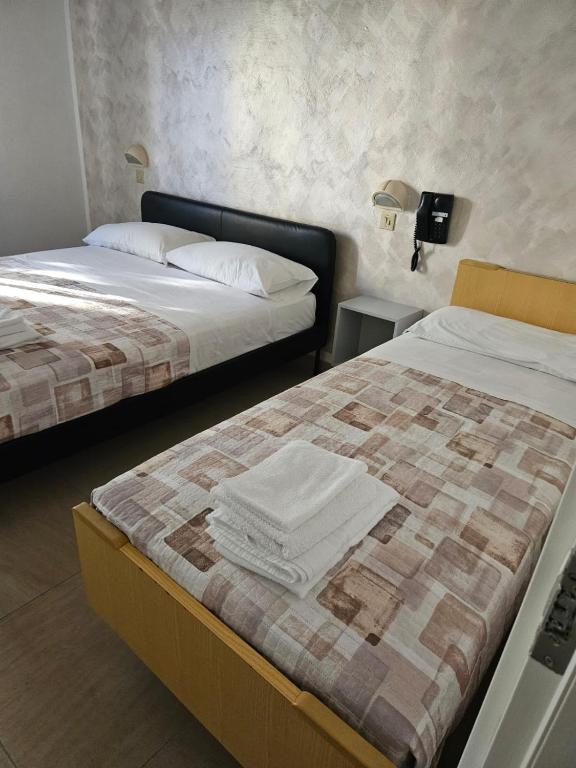 Postel nebo postele na pokoji v ubytování PAPER MOON