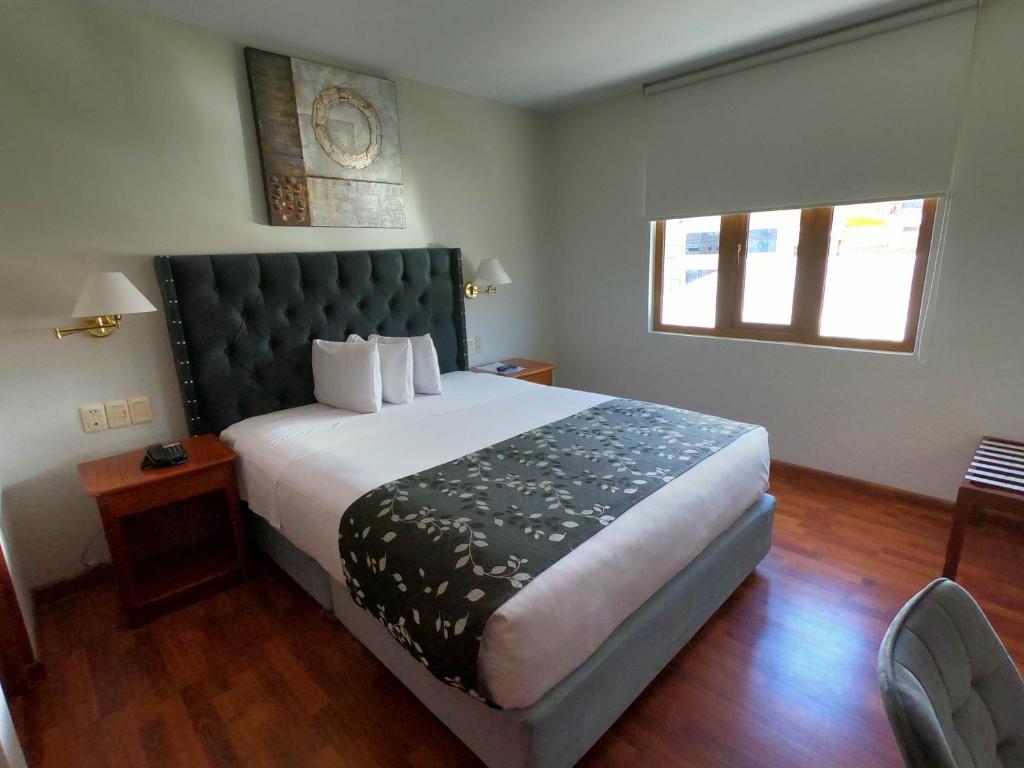 Cama o camas de una habitación en Casona Plaza Hotel Puno