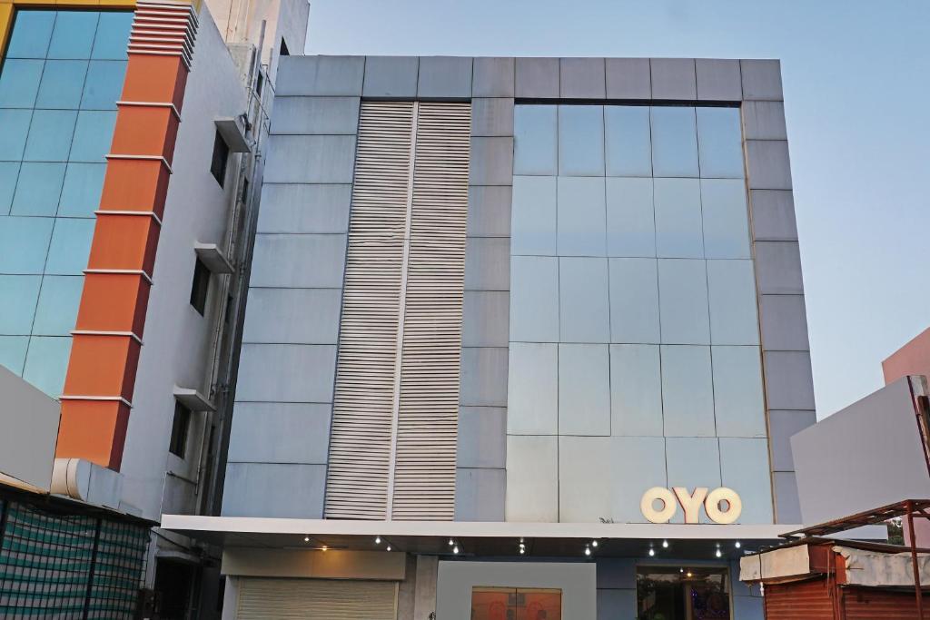 a view of a building with the ovy logo on it at OYO Hotel Shirdi Sai Inn in Shirdi