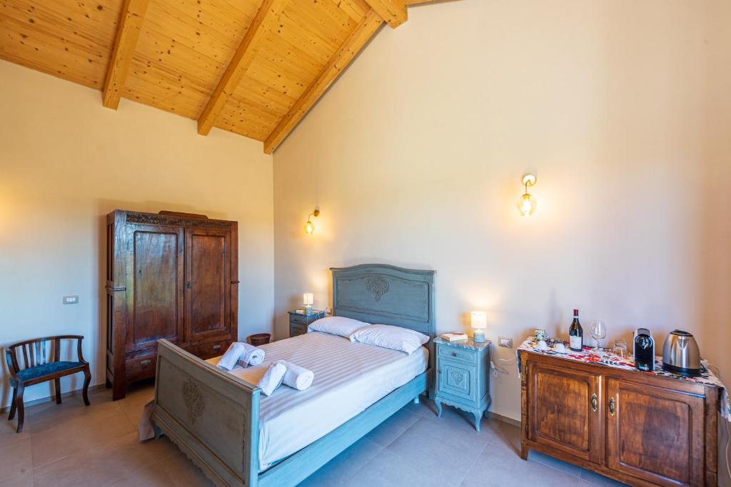 Postel nebo postele na pokoji v ubytování LeCoste rooms, Monforte
