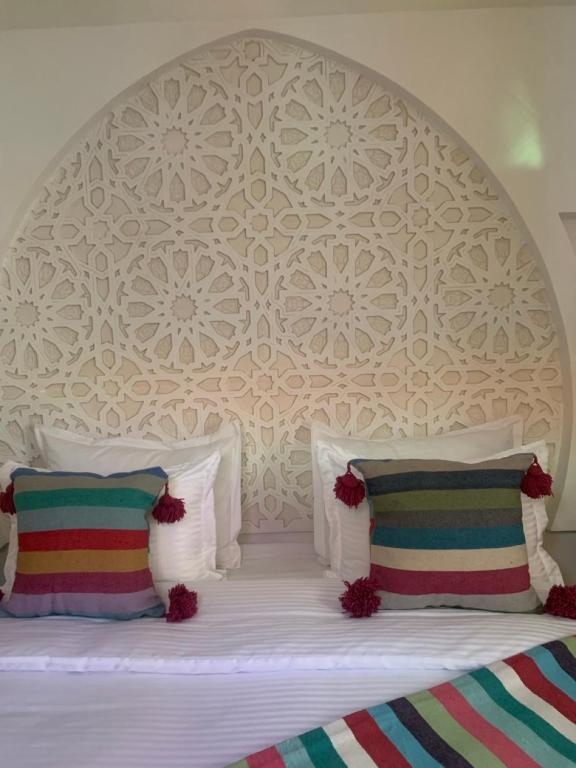Postel nebo postele na pokoji v ubytování Riad SunSet Marrakech