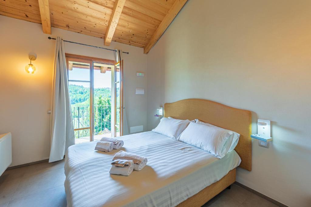 Postel nebo postele na pokoji v ubytování LeCoste rooms, Monforte