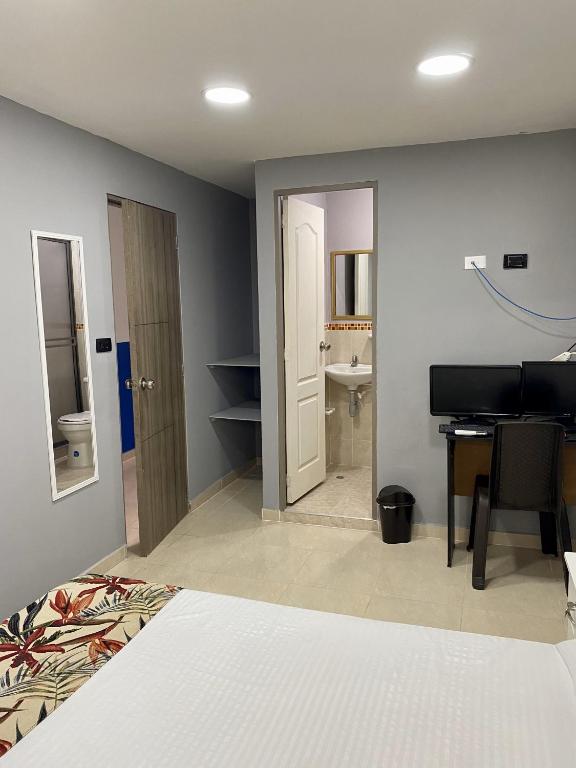 Una cama o camas en una habitación de Casa Mango