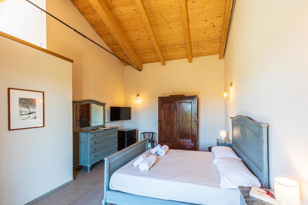 Postel nebo postele na pokoji v ubytování LeCoste rooms, Monforte