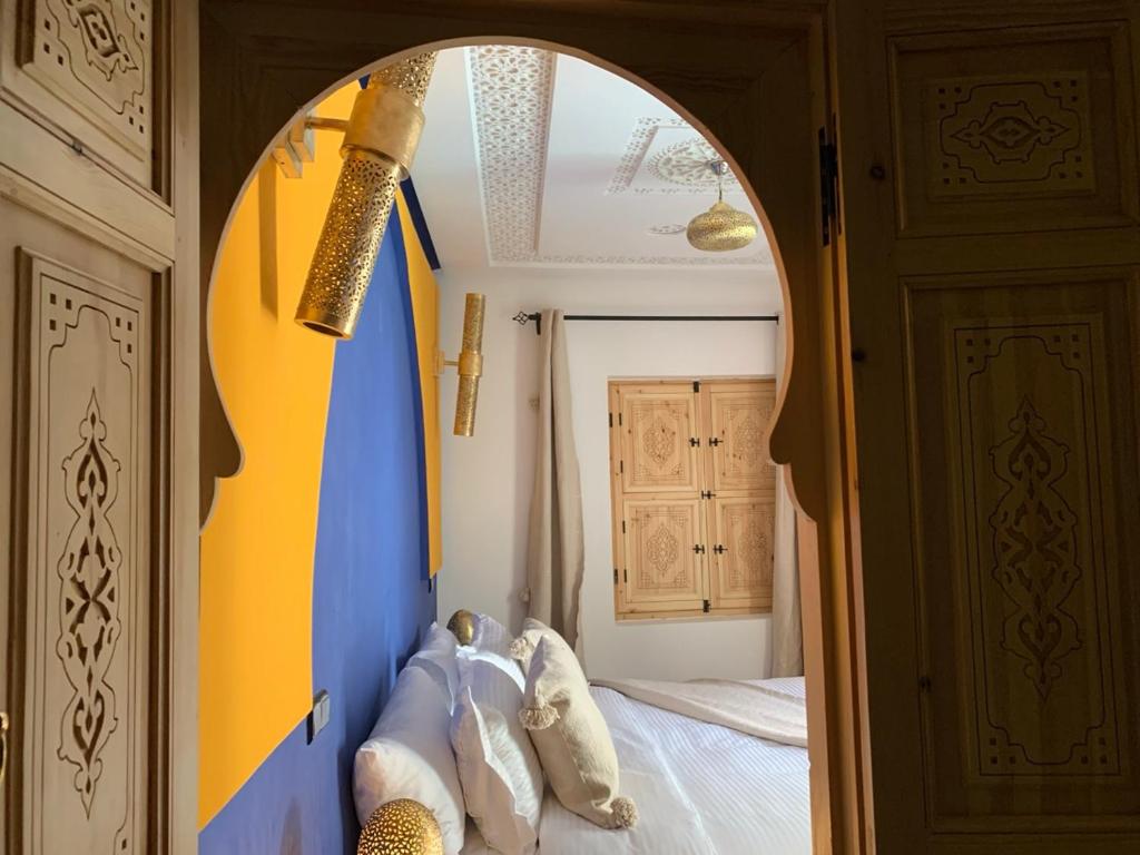 Postel nebo postele na pokoji v ubytování Riad SunSet Marrakech