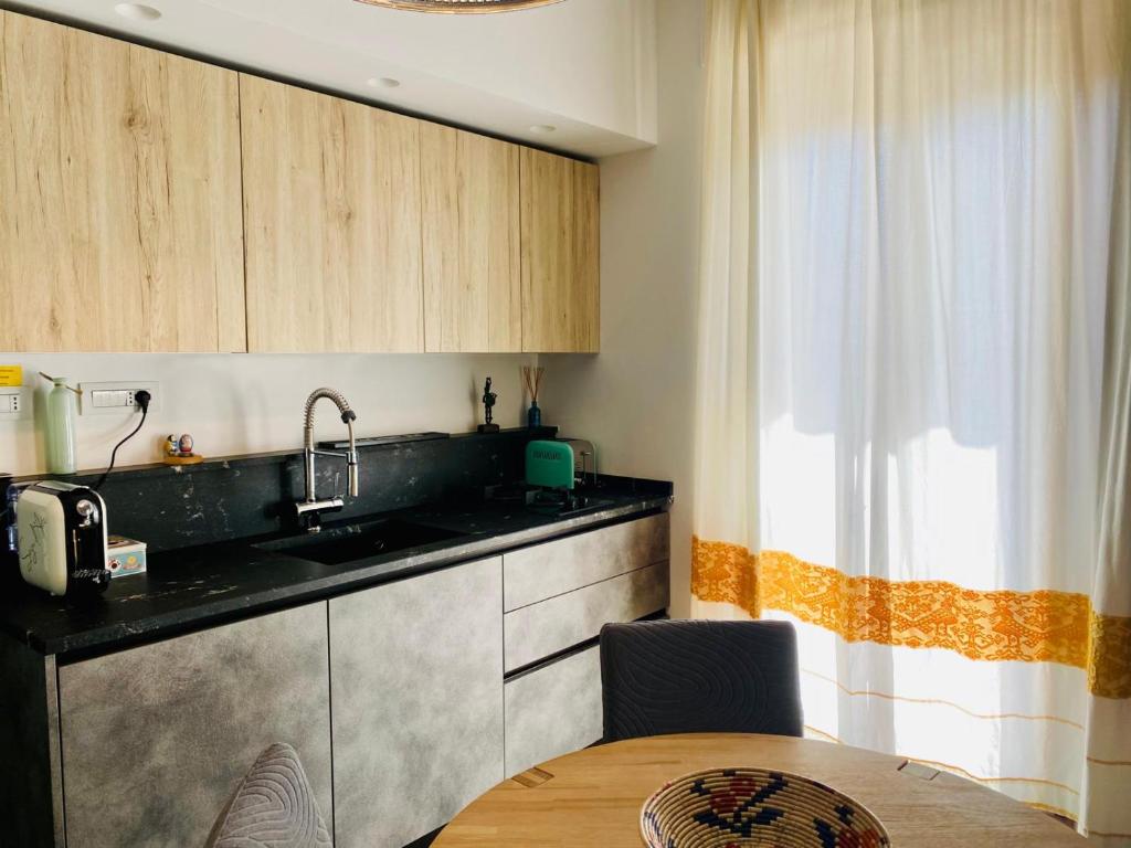 Een keuken of kitchenette bij S'accabbadora Guest House