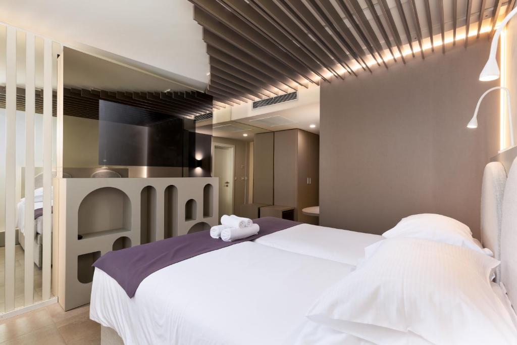 Postel nebo postele na pokoji v ubytování Hotel Emaus