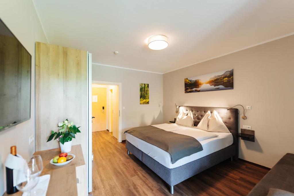 a bedroom with a bed in a room at Familienhotel Trebesingerhof in Trebesing