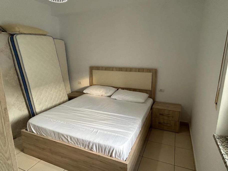a small bed in a small room with at Grand Hotel Europa Resort Velipoje Apartment in Velipojë