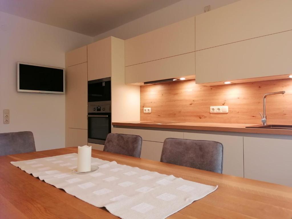 Televízia a/alebo spoločenská miestnosť v ubytovaní Appartement Gundi Ripper