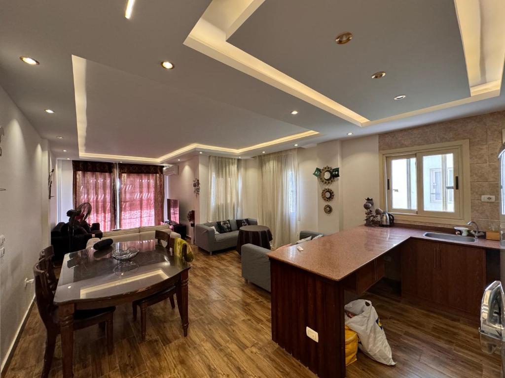 a kitchen and living room with a large island at فيلا مميزه جدا في الساحل الشمالي ستيلا هايتس Stella Heights - Sidi Abd El-Rahman villa type M in El Alamein