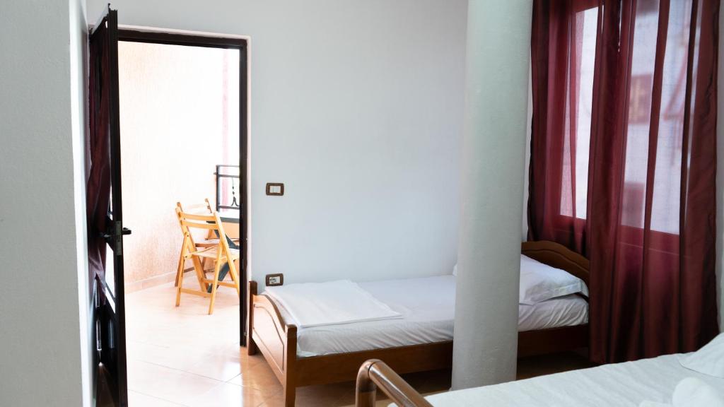 Postel nebo postele na pokoji v ubytování Villa ReyAn Durrës