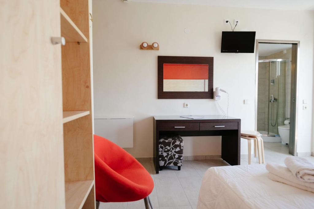 Postel nebo postele na pokoji v ubytování Helena Hotel