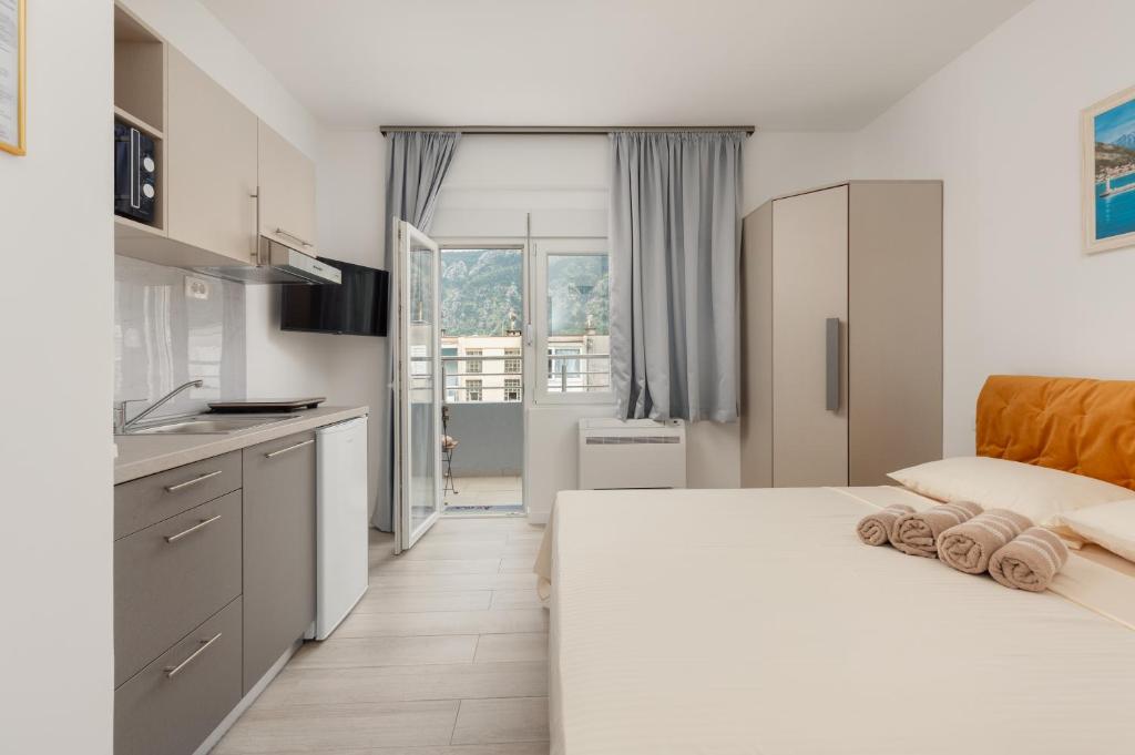 Voodi või voodid majutusasutuse Apartments TIME toas