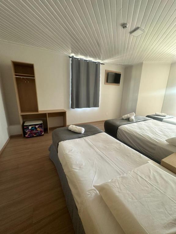 Posteľ alebo postele v izbe v ubytovaní Unity Hotel - Votorantim - SP