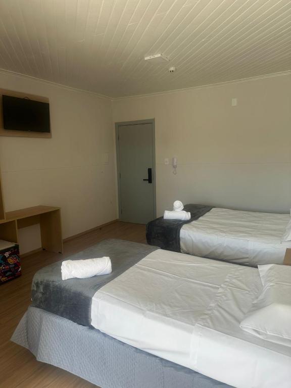 Posteľ alebo postele v izbe v ubytovaní Unity Hotel - Votorantim - SP