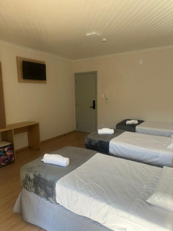 Posteľ alebo postele v izbe v ubytovaní Unity Hotel - Votorantim - SP