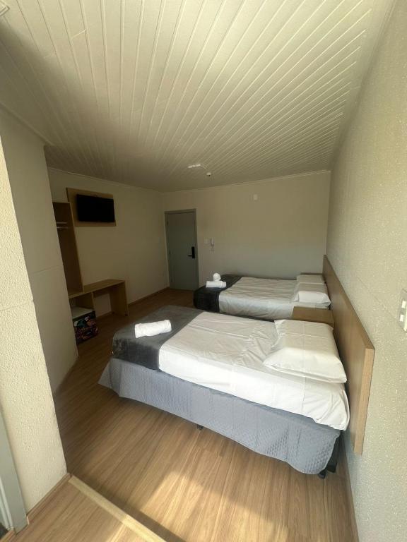Posteľ alebo postele v izbe v ubytovaní Unity Hotel - Votorantim - SP
