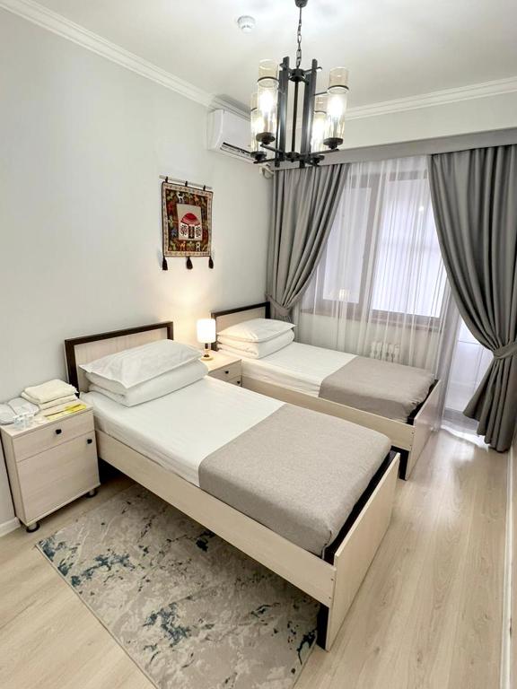 Postel nebo postele na pokoji v ubytování Compass Hostel
