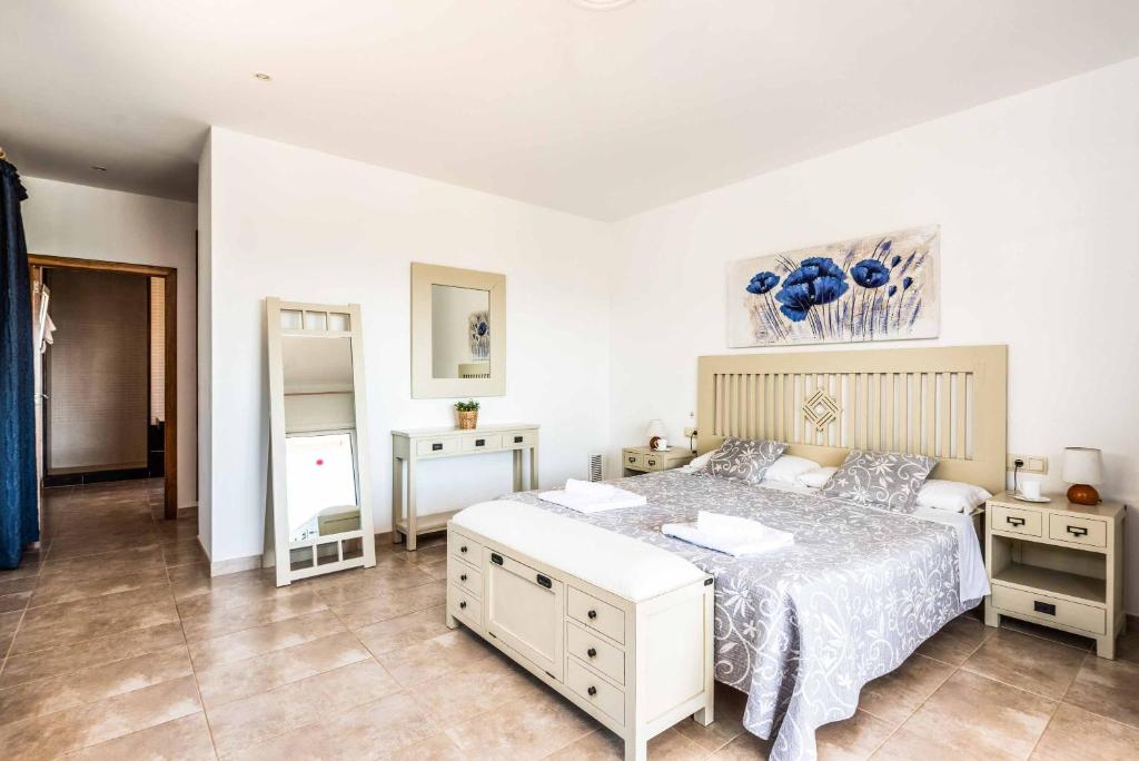A bed or beds in a room at Villa Satalaia