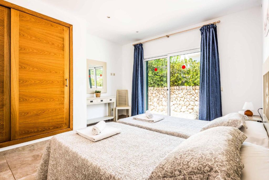 A bed or beds in a room at Villa Satalaia