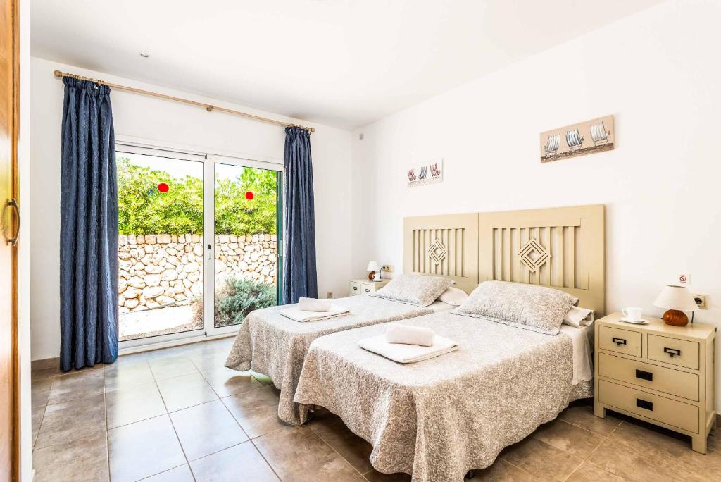 A bed or beds in a room at Villa Satalaia
