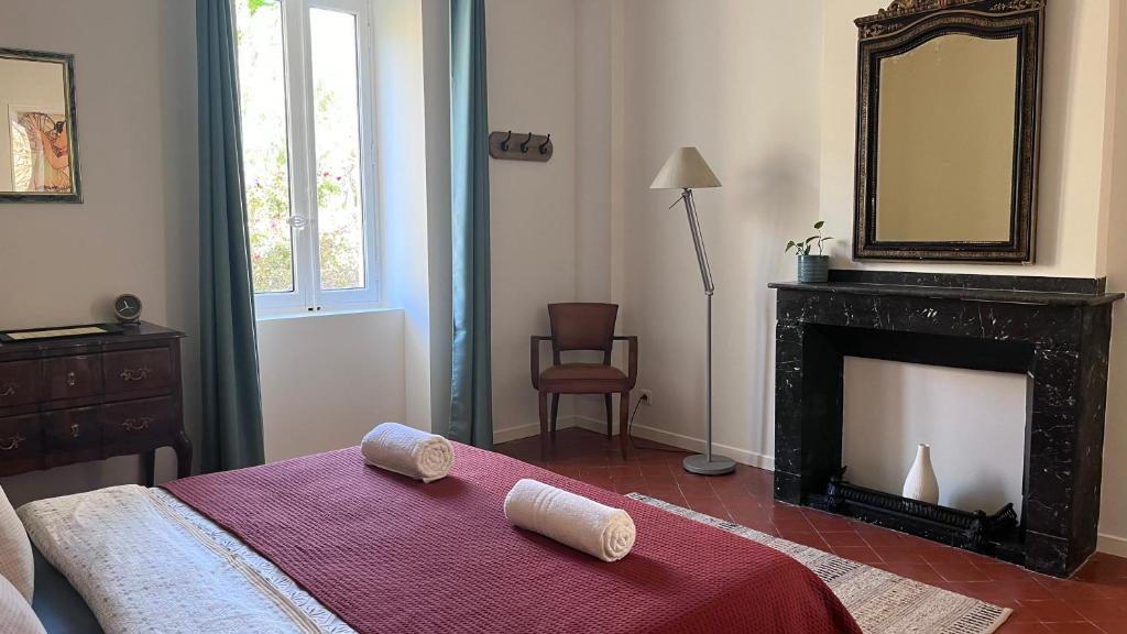 Postel nebo postele na pokoji v ubytování Abri du vent, chambres et appartements