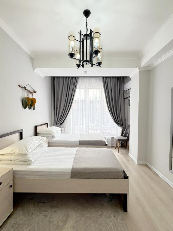Postel nebo postele na pokoji v ubytování Compass Hostel