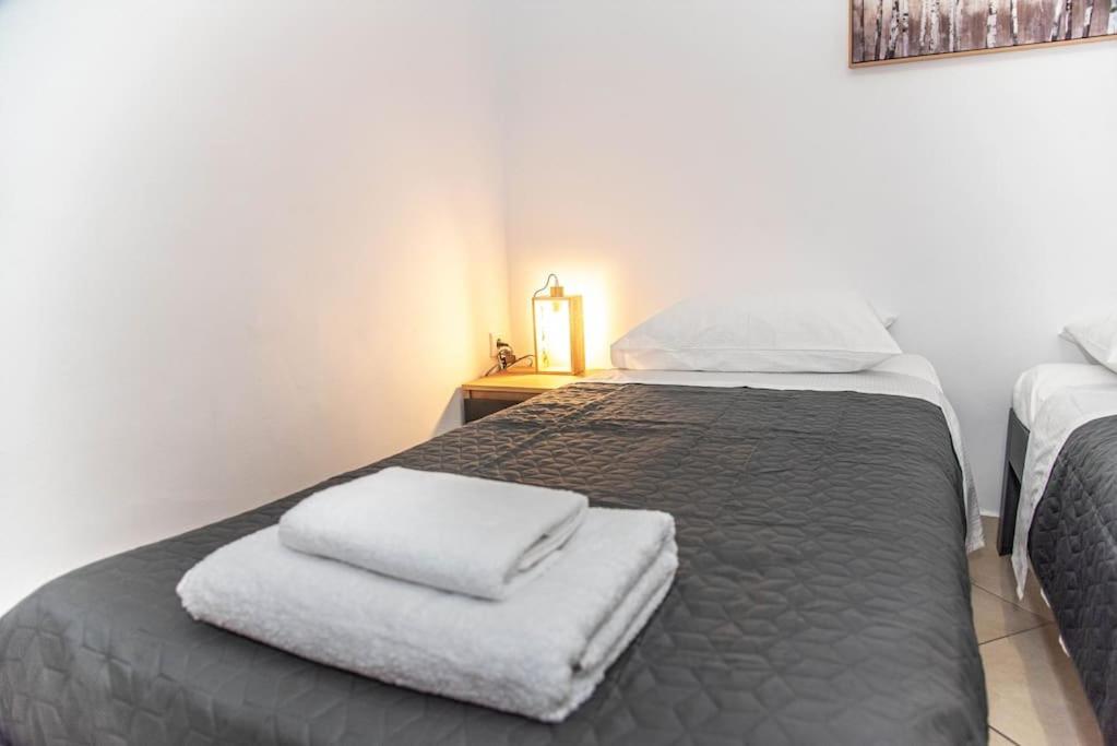 Postel nebo postele na pokoji v ubytování Sotiris Apartment