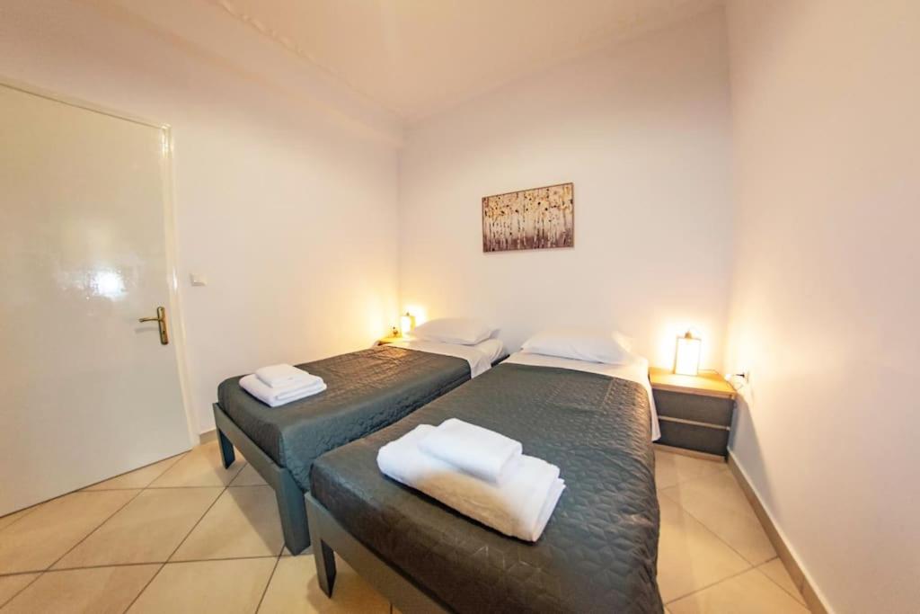 Postel nebo postele na pokoji v ubytování Sotiris Apartment