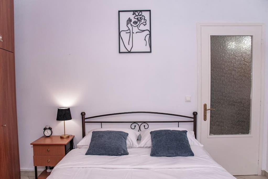 Postel nebo postele na pokoji v ubytování Sotiris Apartment