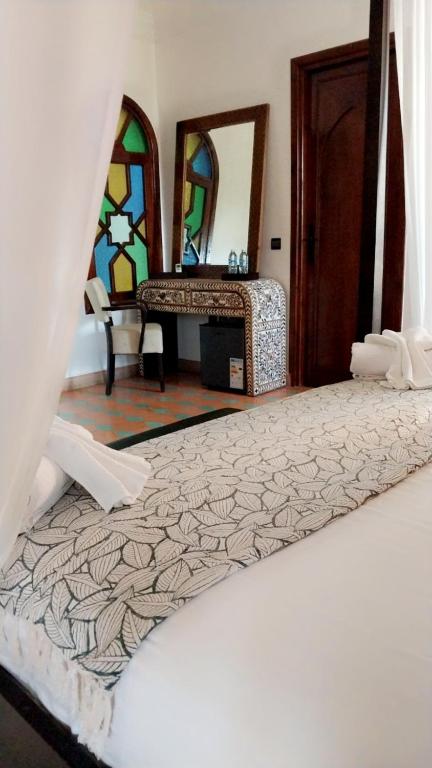 Postel nebo postele na pokoji v ubytování Las Palmeras Guest House