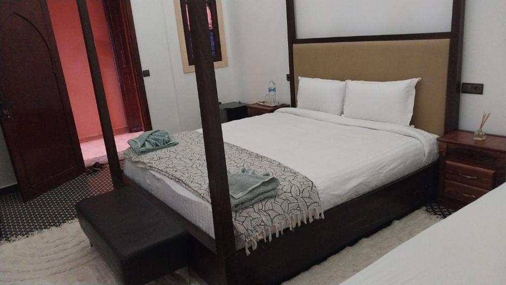 Postel nebo postele na pokoji v ubytování Las Palmeras Guest House