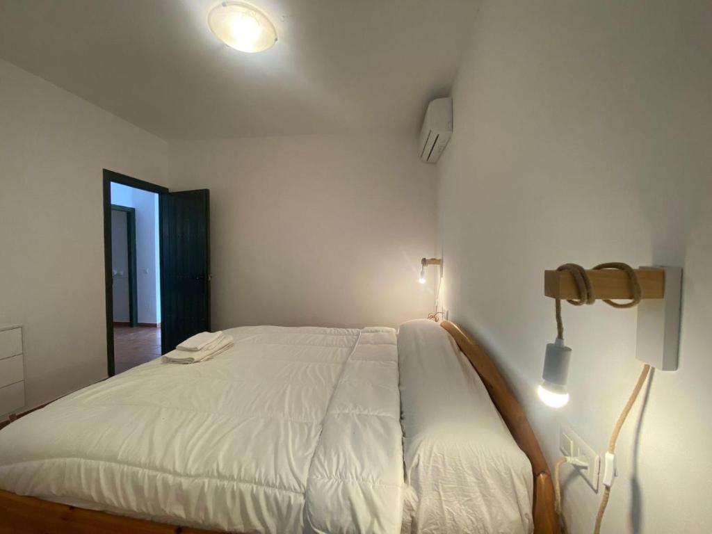 Postel nebo postele na pokoji v ubytování Villa Numa