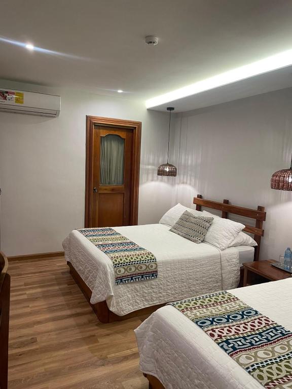 Postel nebo postele na pokoji v ubytování Hotel Dos Rios