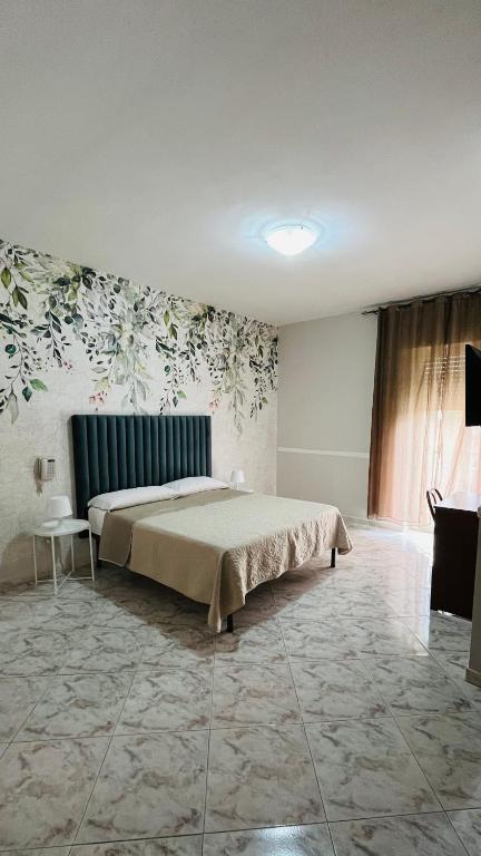 Postel nebo postele na pokoji v ubytování Hotel Stefany