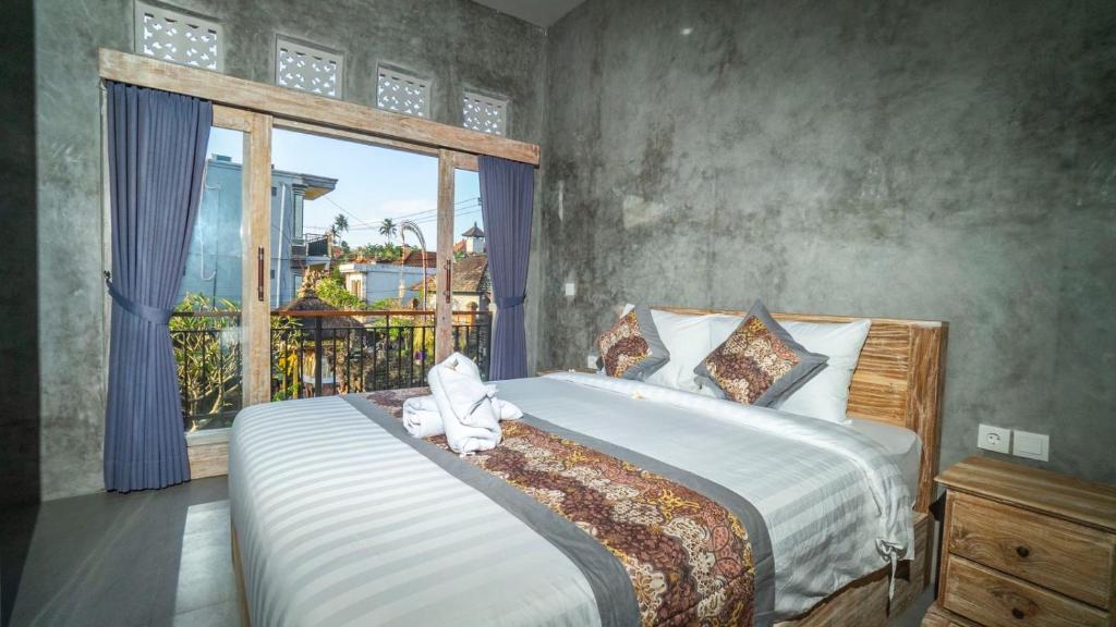 Postel nebo postele na pokoji v ubytování Skyline House Ubud View by EPS