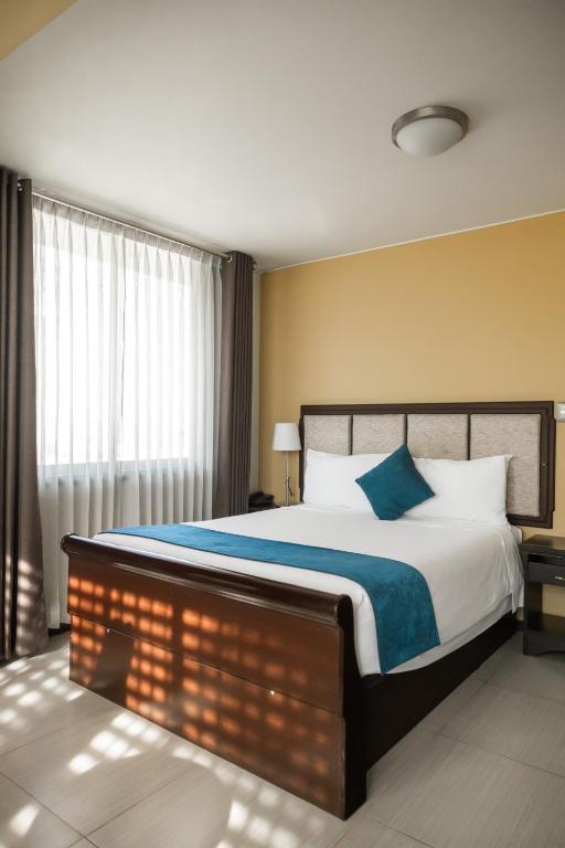 Postel nebo postele na pokoji v ubytování Hotel D'Carlo Class