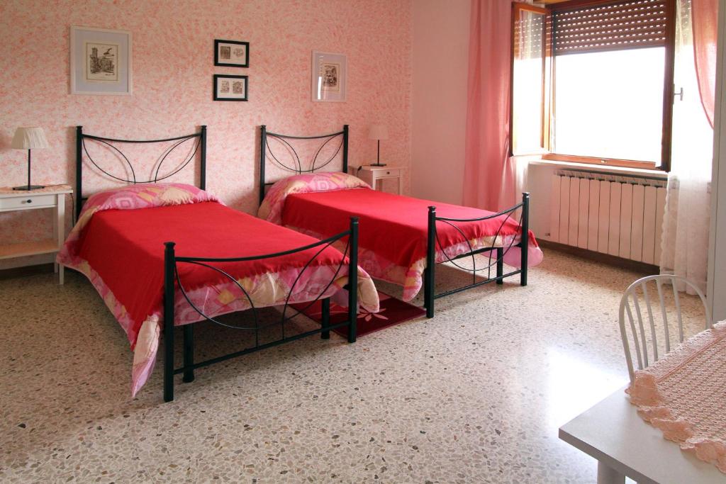 Postel nebo postele na pokoji v ubytování B&B L'Armonia