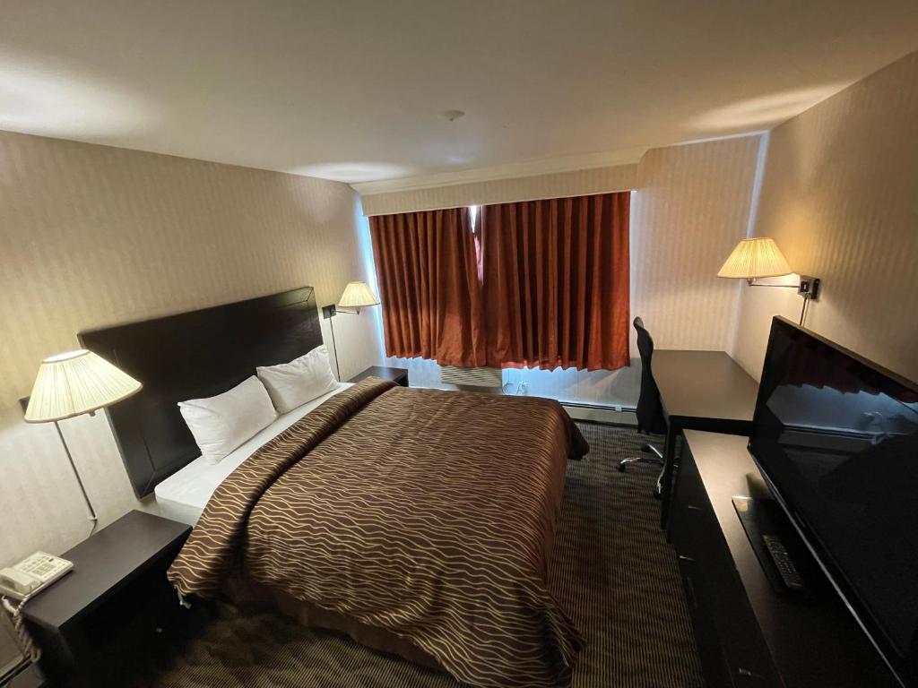 Postel nebo postele na pokoji v ubytování Almac Hotel