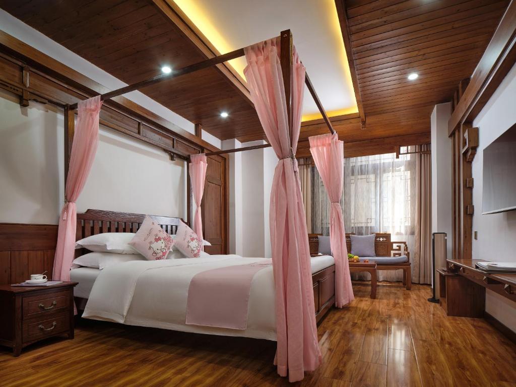 Postel nebo postele na pokoji v ubytování Lee's Boutique Resort