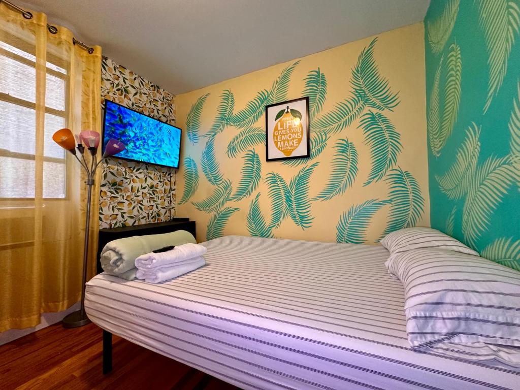 a bedroom with a large bed with a purple mattressvisor at Lemon private room with shared bathroom in New York