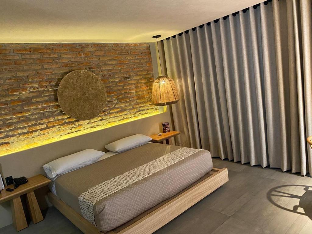 Postel nebo postele na pokoji v ubytování Motel London