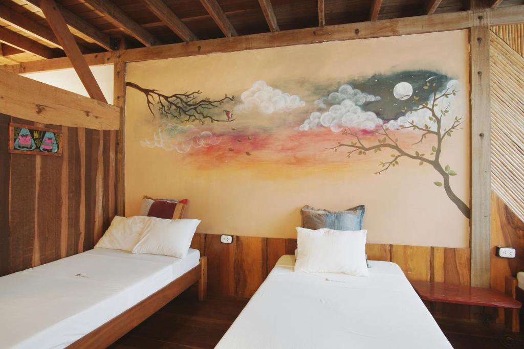 Postel nebo postele na pokoji v ubytování La Fauna Hotel