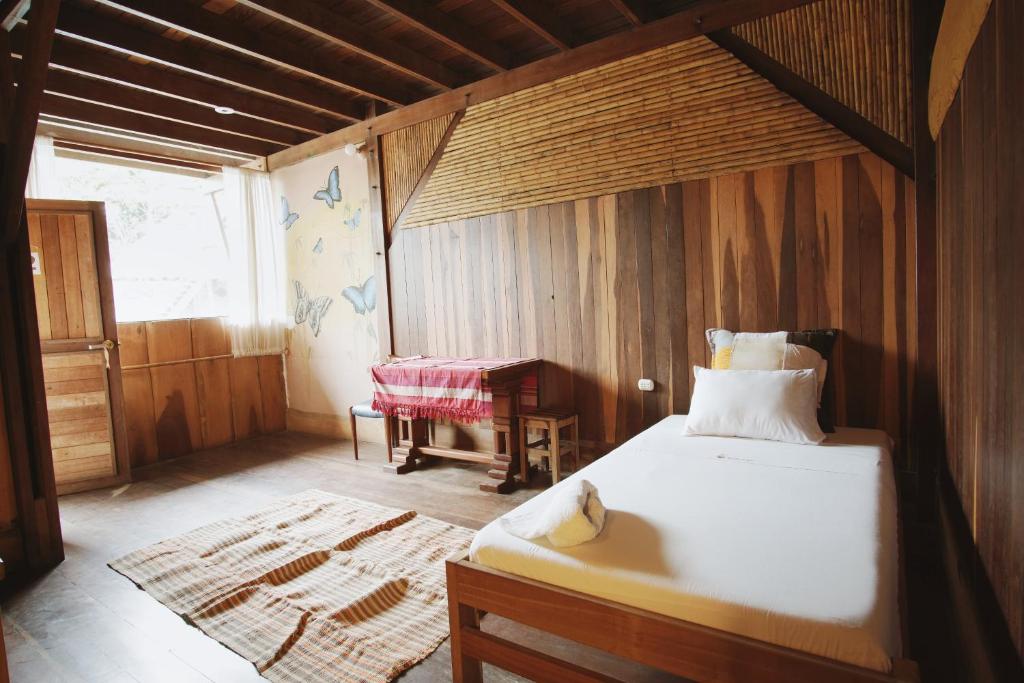 Postel nebo postele na pokoji v ubytování La Fauna Hotel