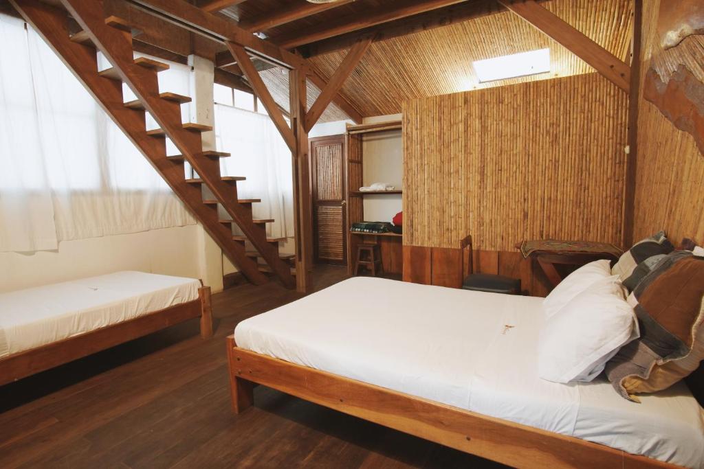 Postel nebo postele na pokoji v ubytování La Fauna Hotel