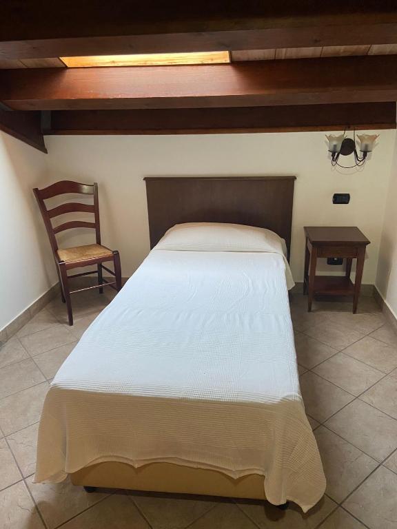 Postel nebo postele na pokoji v ubytování Hotel Capomulini 3 Stelle