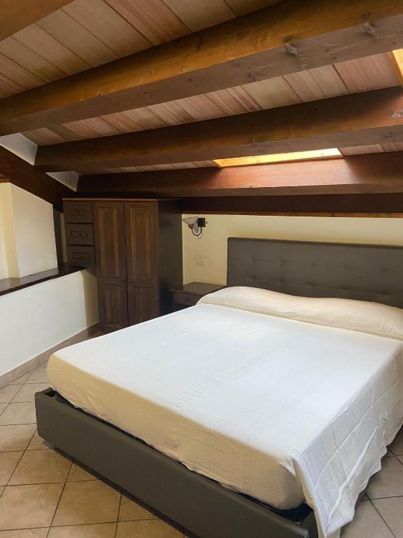 Postel nebo postele na pokoji v ubytování Hotel Capomulini 3 Stelle
