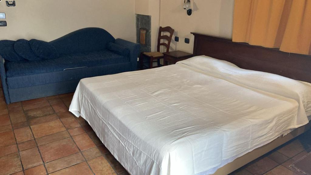 Postel nebo postele na pokoji v ubytování Hotel Capomulini 3 Stelle