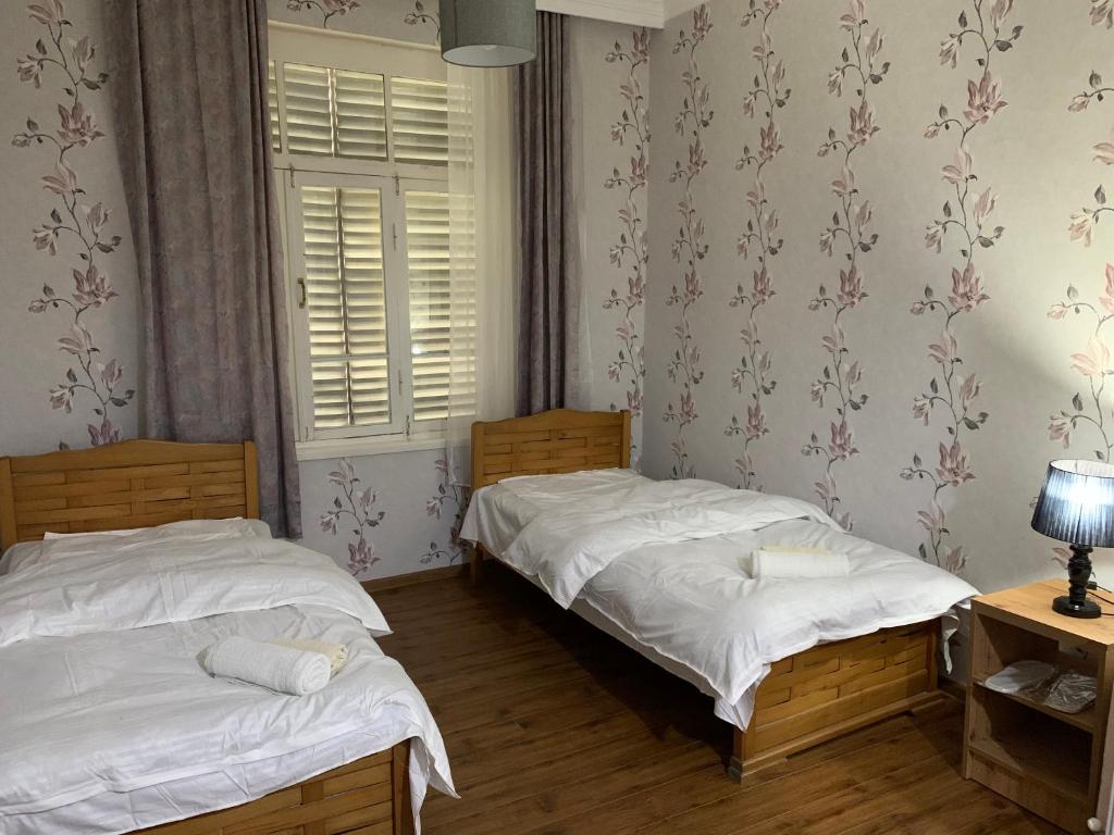 Postel nebo postele na pokoji v ubytování Villa Bodbe
